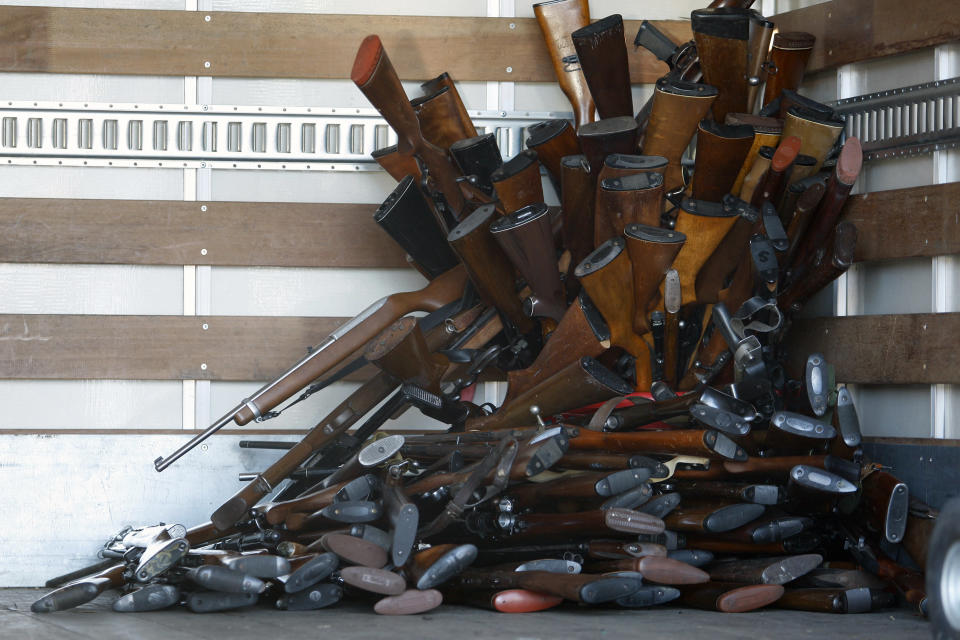 A small portion of guns that were turned in by their owners are stacked inside a truck at a gun buyback held by the Los Angeles Police Department in Los Angeles, California, December 26, 2012 following the mass shooting at Sandy Hook Elementary School in Connecticut. The program normally occurs in May but Los Angeles mayor Antonio Villaraigosa accelerated the schedule in response to the December 14 shooting that left 20 children and six adults dead, along with the gunman, and caused a national outcry against gun violence. People can anonymously trade in their guns, no questions asked, for $200 grocery store gift cards for automatic weapons and $100 gift cards for shotguns, handguns and rifles. REUTERS/David McNew (UNITED STATES - Tags: CRIME LAW SOCIETY)