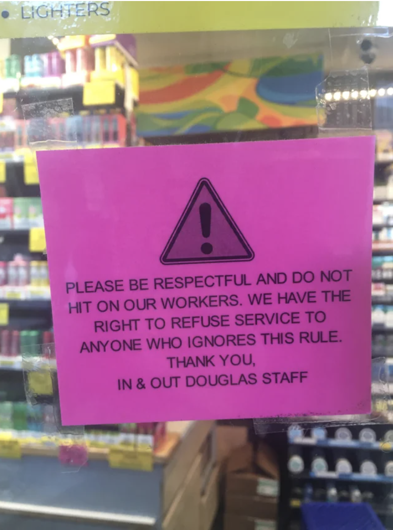 The sign says "please be respectful and do not hit on our workers; we have the right to refuse service to anyone who ignores this rule"