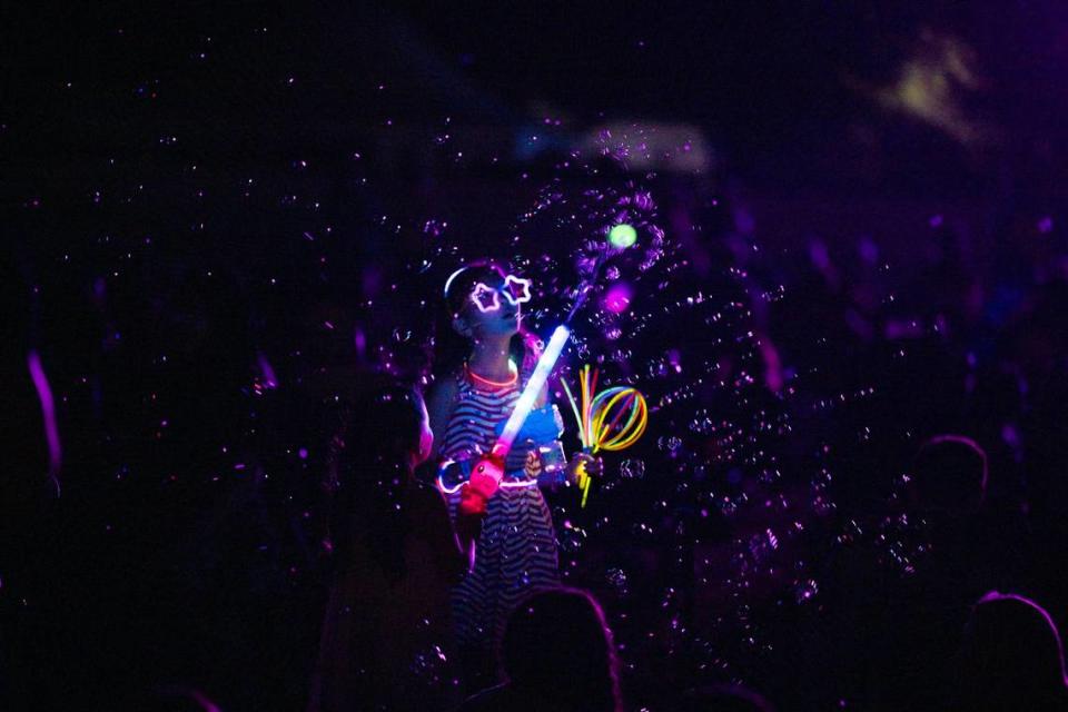 A child plays with lights and bubbles before the Rancho Cordova Fourth of July fireworks show on Wednesday, July 3, 2024, at Hagan Community Park in Rancho Cordova.