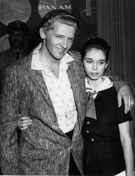 Seen at a London press conference on May 24, 1958 are Jerry Lee Lewis, 22, and his cousin, Myra Brown, 13.