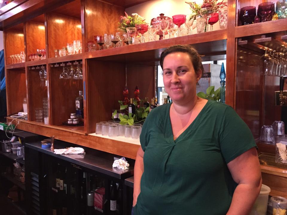 Cara Chigazola-Tobin, chef-owner of Honey Road, stands behind the bar at the Burlington restaurant July 29, 2021.