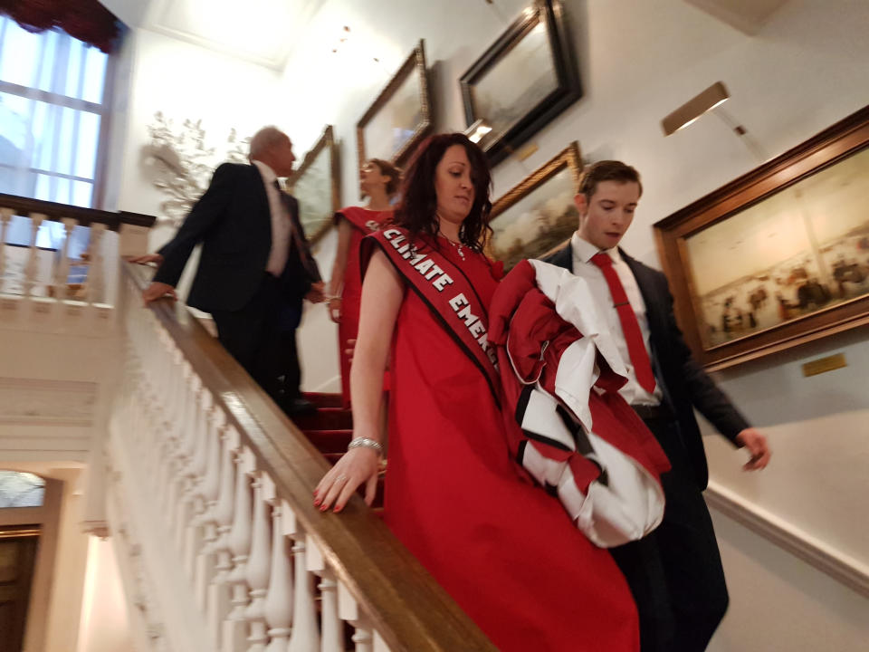 Handout photos issued by Greenpeace of climate change activists being escorted from Mansion House in London where they interrupted a speech by Chancellor Philip Hammond at the annual Bankers and Merchants Dinner.