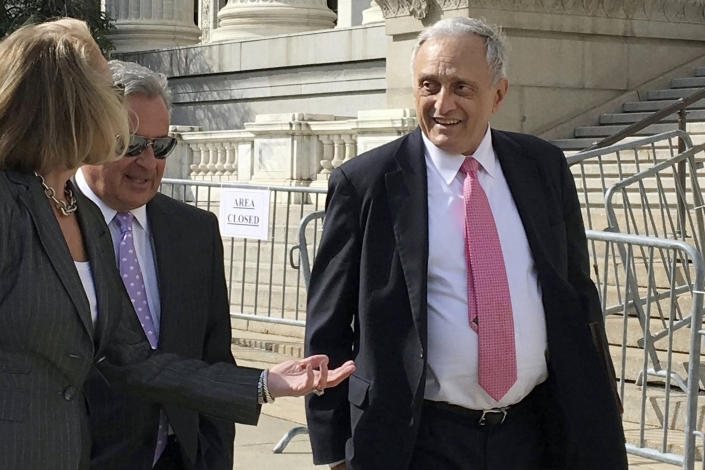 FILE - Carl Paladino, right, walks with his lawyers outside the state Department of Education building, June 22, 2017, in Albany, N.Y. (AP Photo/Mary Esch, File)