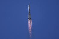 A Long March-2F Y12 rocket carrying a crew of Chinese astronauts in a Shenzhou-12 spaceship lifts off at the Jiuquan Satellite Launch Center in Jiuquan in northwestern China, Thursday, June 17, 2021. China launched the first three crew members on a mission to its new space station Thursday in its first crewed mission in five years.(AP Photo/Ng Han Guan)