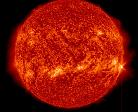 A full-disk view of the sun as an X1.3-class solar flare (far right) erupts on April 24, 2014 EDT (April 25 GMT).