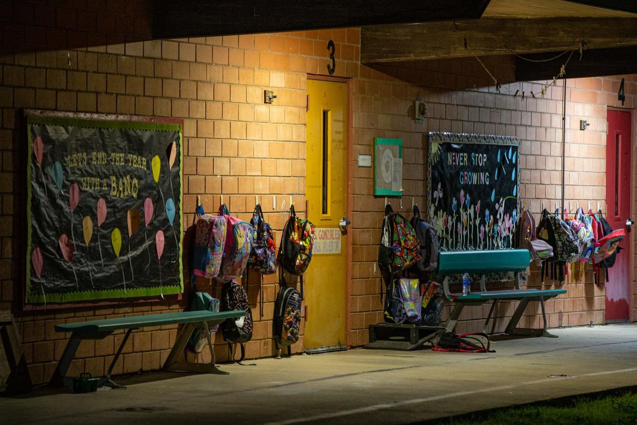 Backpacks hang on hooks outside of classrooms at Dalton Early Childhood Center in Uvalde, Texas, on May 24, 2022. The pre-kindergarten through first grade school is about 2 miles from Robb Elementary, the scene of a mass shooting.