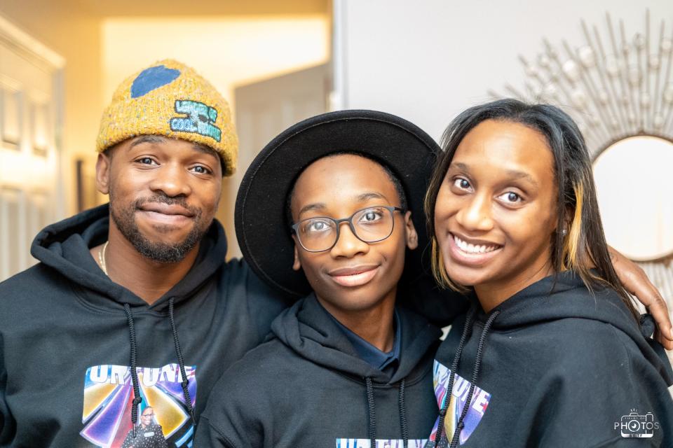 Kaden Nye, 13, (middle) celebrates his appearance on "Wheel of Fortune"  by hosting a watch party with loved ones on Feb. 22, 2023. The group had "Wheel of Fortune" apparel made with Kaden's photo on the set.