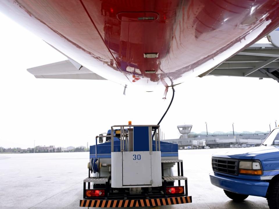 An airplane is being serviced on an airport platform. Getty Images/iStockphoto