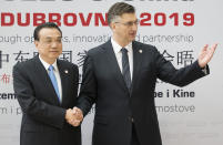 Croatia's Prime Minister Andrej Plenkovic, right, welcomes his Chinese counterpart Li Keqiang at the Summit of Central and Eastern Europe and China in Dubrovnik, Croatia, Friday, April 12, 2019. EU member Croatia is hosting a two-day summit between China and 16 regional countries on expanding business between China and the region, which is dubbed 16+1. (AP Photo/Darko Bandic)
