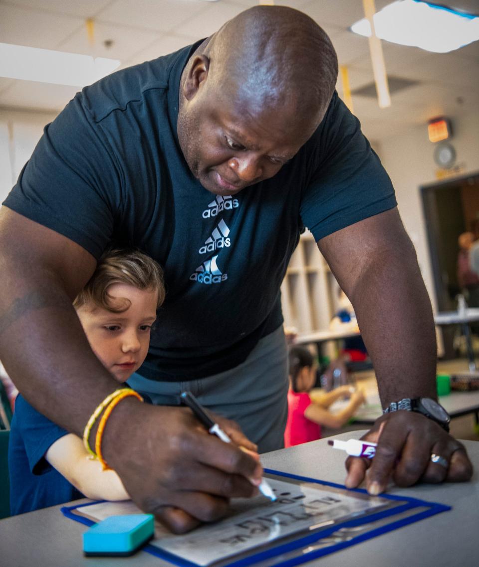 Teacher Andre Rush instructs Atticus Martindale during Monroe County Community School Corporation's Jump Start program at Summit Elementary School on Friday, July 21, 2023.