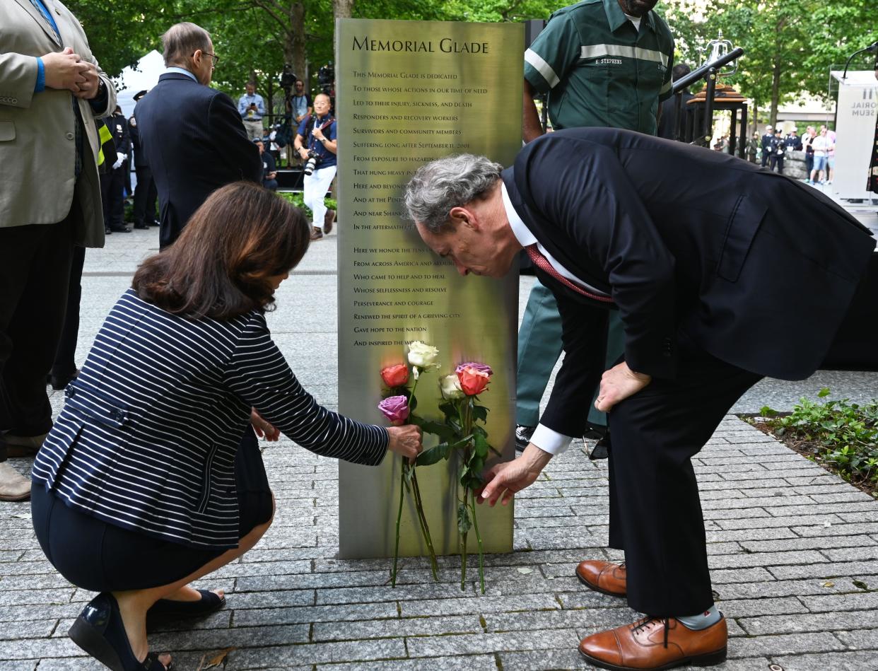 Governor Hochul and First Gentleman Bill Hochul lay flowers at the 9/11 Memorial Glade monument on Monday. 