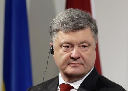 President of Ukraine Petro Poroshenko listens during the news conference in Riga, Latvia April 4, 2017. REUTERS/Ints Kalnins