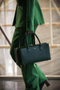 <p>A model carries a boxy, rectangular bag from the Claudia Li FW18 show. (Photo: Getty Images) </p>