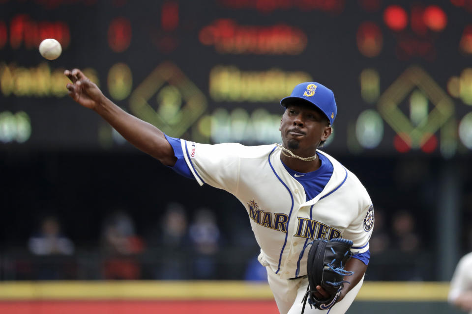 Seattle Mariners starting pitcher Justin Dunn throws against the Oakland Athletics in the second inning of a baseball game Sunday, Sept. 29, 2019, in Seattle. (AP Photo/Elaine Thompson)