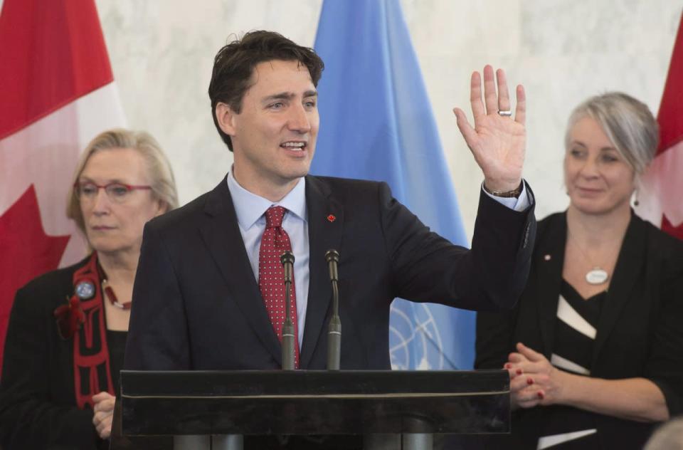 Prime Minister Justin Trudeau waves as he wraps up his remarks during an event at the United Nations headquarters in New York, Wednesday, March 16, 2016. THE CANADIAN PRESS/Adrian Wyld