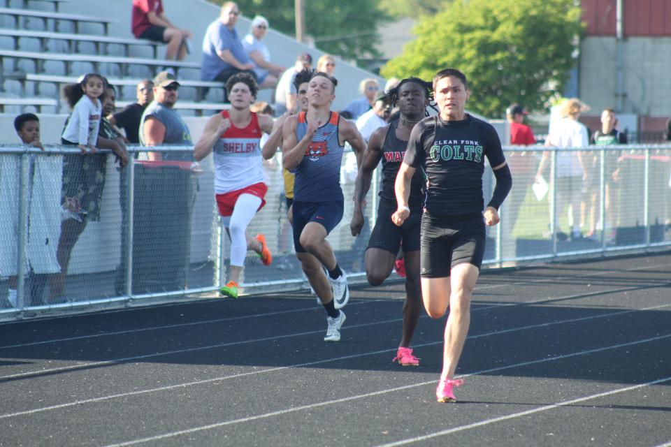 Clear Fork's Joe Stupka cruises for the victory in the 200 meter final.