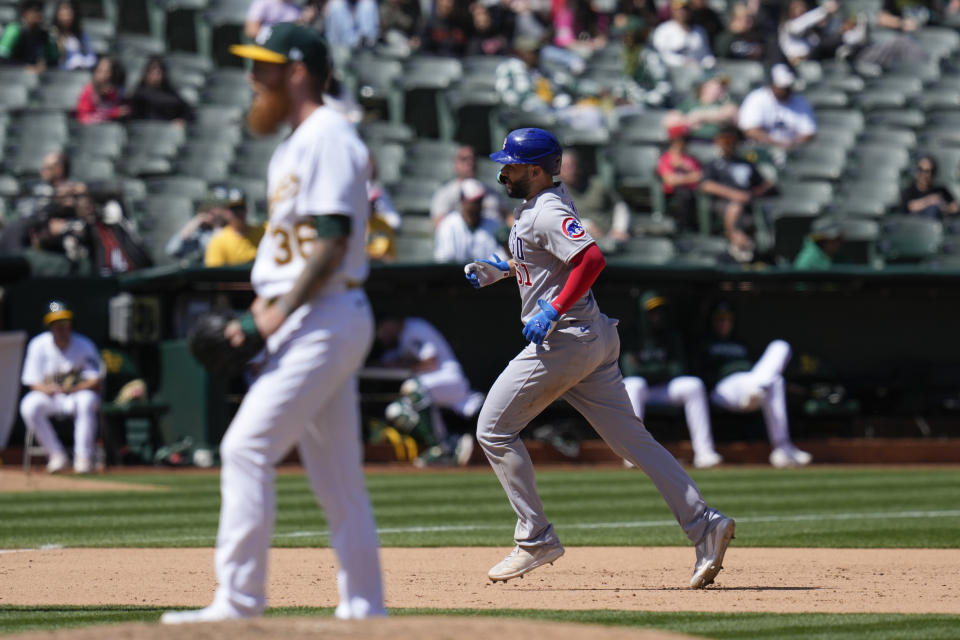 Chicago Cubs' Eric Hosmer, right, runs the bases after hitting a solo home run against the Oakland Athletics during the eighth inning of a baseball game in Oakland, Calif., Wednesday, April 19, 2023. (AP Photo/Godofredo A. Vásquez)