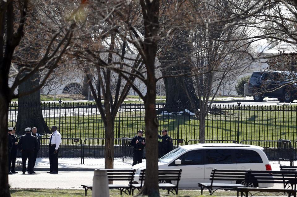 US Secret Service officers stand in the cordoned off area on Pennsylvania Avenue after a security incident near the fence of the White House in Washington, Saturday, March 18, 2017. President Trump was not at the White House at the time of the incident. (AP Photo/Alex Brandon)