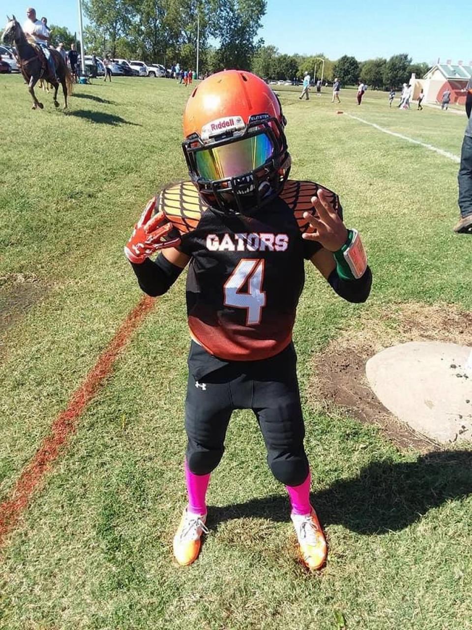 Graceson Littleton poses for a picture while playing for the Wichita Gators. The team won a city championship when he was in the fourth grade.