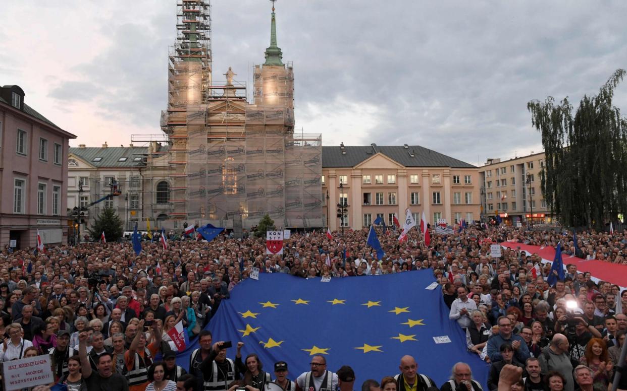 Thousands of demonstrators turned out in support of Poland's supreme court judges in Warsaw in July - AFP