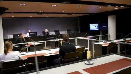The initial remand hearing of Abderrahman Mechkah (lying in a hospital bed, attending the court session via video), 18 year-old Moroccan man suspected of killing two people and attempting to kill eight others with terrorist intent in Turku, on Friday, August 19, is held at Southwest Finland District Court in Turku, Finland, August 22, 2017. LEHTIKUVA /Martti Kainulainen via REUTERS