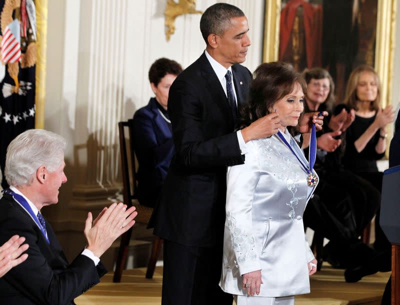 FILE PHOTO: U.S. President Barack Obama presents the Presidential Medal of Freedom to singer Loretta Lynn at a ceremony in the East Room of the White House in Washington