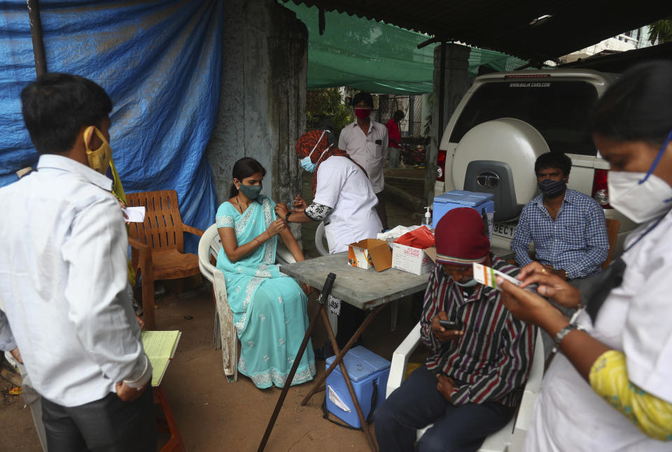 A health worker administers the Covishield vaccine during a special vaccination drive against COVID-19 in Hyderabad, India, Friday, June 25, 2021. (AP Photo/Mahesh Kumar A.)