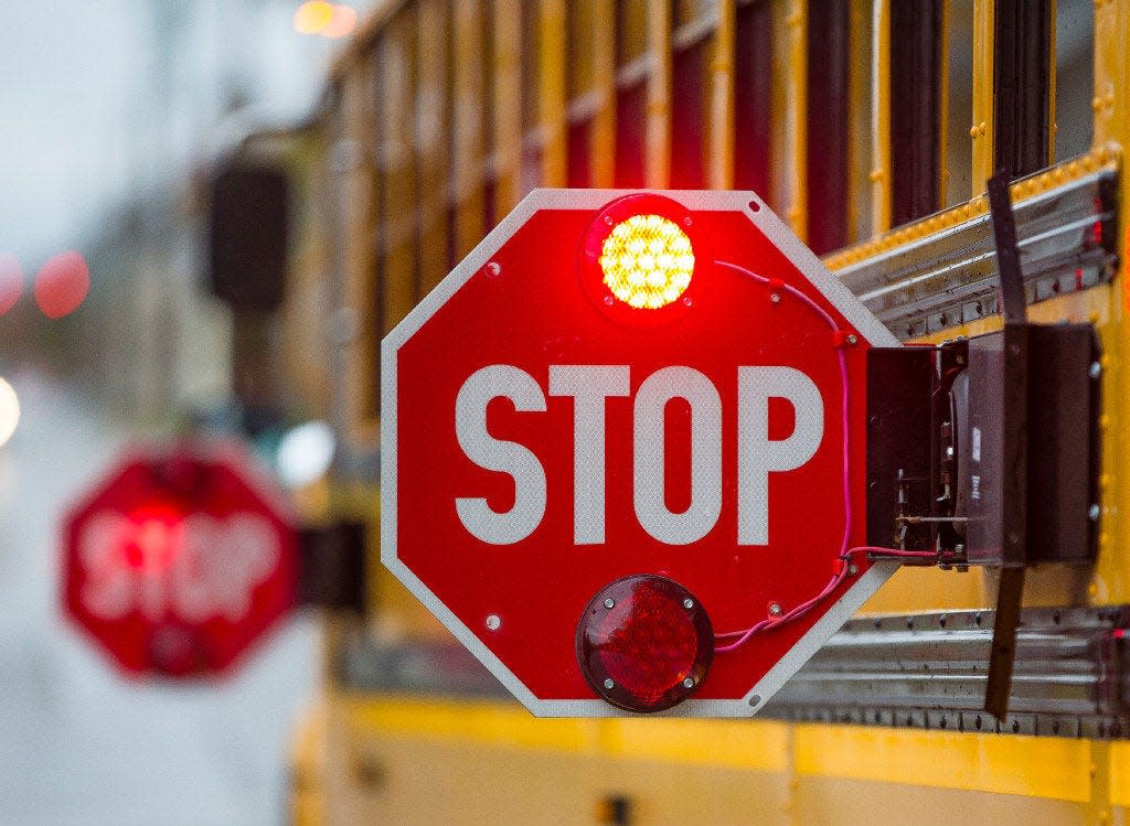 A South Bend school bus makes a stop on its route last year.