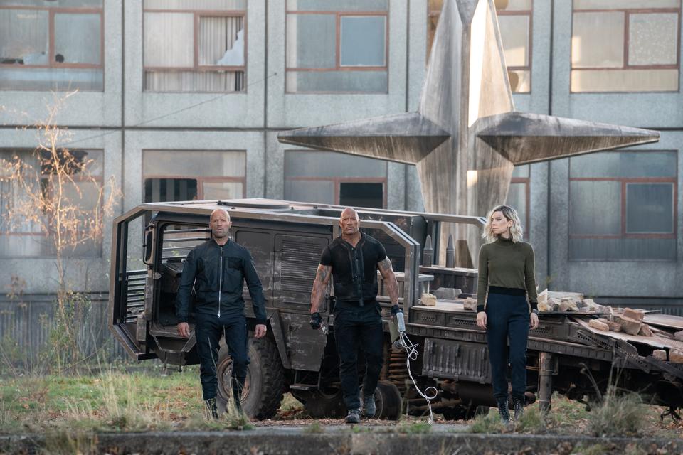 Luke Hobbs (Dwayne Johnson), Deckard Shaw (Jason Statham), and Hattie Shaw (Vanessa Kirby) team up and face off in Fast & Furious Presents: Hobbs & Shaw, directed by David Leitch. (Credit: Universal) 