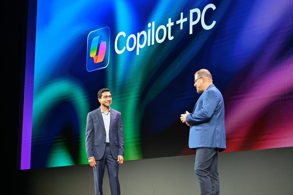 TAIPEI, TAIWAN - JUNE 3: Pavan Davuluri, Microsoft's Windows and Surface chief, joins Qualcomm President and CEO Cristiano Amon during his Keynote Presentation at COMPUTEX 2024 on “The PC Reborn” Showcasing Where Innovation Creates Disruption in a Mature Industry, in Taipei, Taiwan, on June 3, 2024. (Photo by Billy H.C. Kwok /Getty Images for Qualcomm)