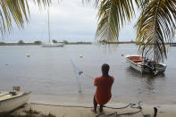 <p>A man pulls in a boat ahead of Hurricane Maria in the Galbas area of Sainte-Anne on the French Caribbean island of Guadeloupe, early Monday, Sept. 18, 2017. (Photo: Dominique Chomereau-Lamotte/AP) </p>