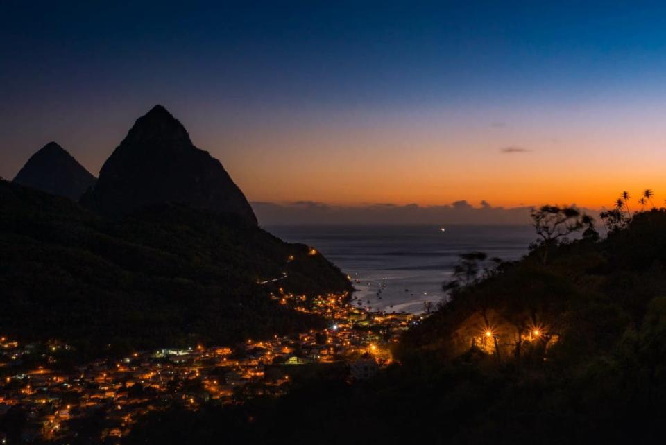 The town of Soufriere lighting up at sunset<br>(Photo: AdobeStock)