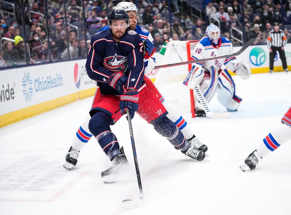 Columbus Blue Jackets center Sean Kuraly (7) fights for a puck with New York Rangers defenseman K'Andre Miller (79) during the first period of the NHL hockey game at Nationwide Arena in Columbus on Thursday, Jan. 27, 2022.