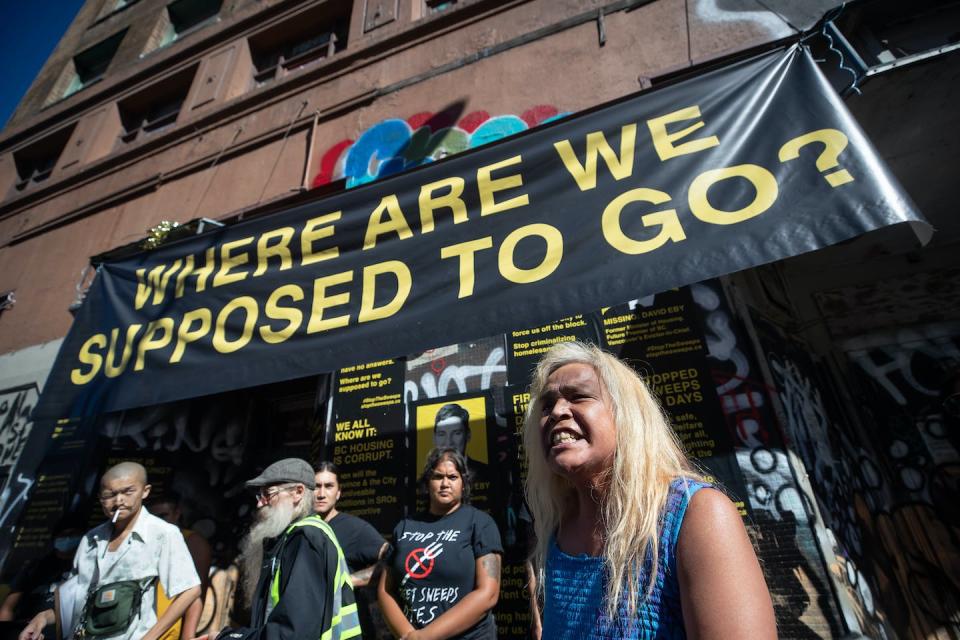 A woman addresses the crowd during a protest against Vancouver’s removal of a homeless encampment on the sidewalks in the Downtown Eastside in August 2022. THE CANADIAN PRESS/Darryl Dyck