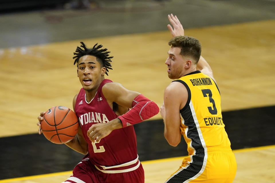 Indiana guard Armaan Franklin drives to the basket past Iowa guard Jordan Bohannon, right, during the first half of an NCAA college basketball game, Thursday, Jan. 21, 2021, in Iowa City, Iowa. (AP Photo/Charlie Neibergall)