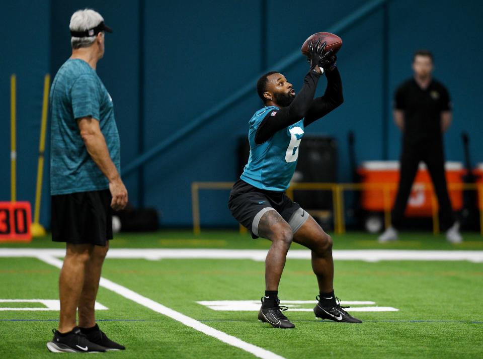 Jacksonville Jaguars Head Coach Doug Pederson looks on as Jacksonville Jaguars wide receiver Jarvis Landry (6) pulls in a ball during Friday's rookie minicamp session. The Jacksonville Jaguars held their first day of rookie minicamp inside the covered field at the Jaguars performance facility in Jacksonville, Florida Friday, May 10, 2024.