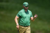 Dean Burmester, of South Africa, waves after making a putt on the third hole during the final round of the PGA Championship golf tournament at the Valhalla Golf Club, Sunday, May 19, 2024, in Louisville, Ky. (AP Photo/Sue Ogrocki)