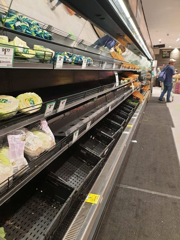 Near empty shelves are seen at a supermarket in Melbourne