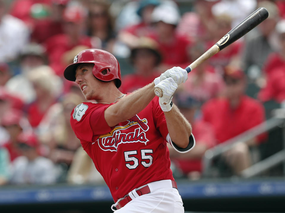 FILE - In this March 23, 2017, file photo, St. Louis Cardinals right fielder Stephen Piscotty (55) bats against the Miami Marlins in a spring training baseball game, in Jupiter, Fla. St. Louis has continued its pattern of locking up young players through the early years of their free agency by signing right fielder Stephen Piscotty to a six-year, $33.5-million contract that could possibly keep him with the Cardinals through the 2023 season with another option year. (AP Photo/John Bazemore, File)