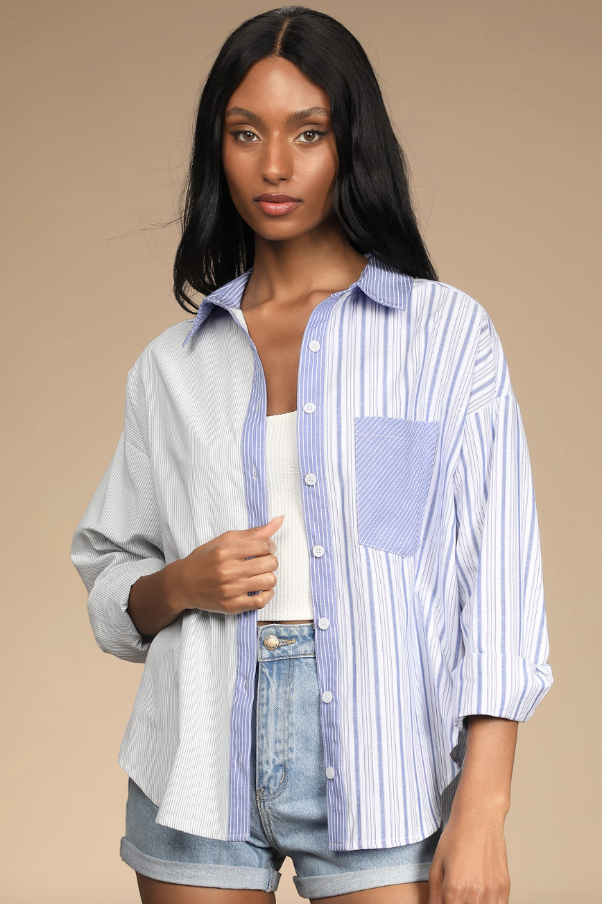 model with black hair in blue striped Nantucket Vibes White Striped Long-Sleeve Button-Up Top (Photo via Lulus)