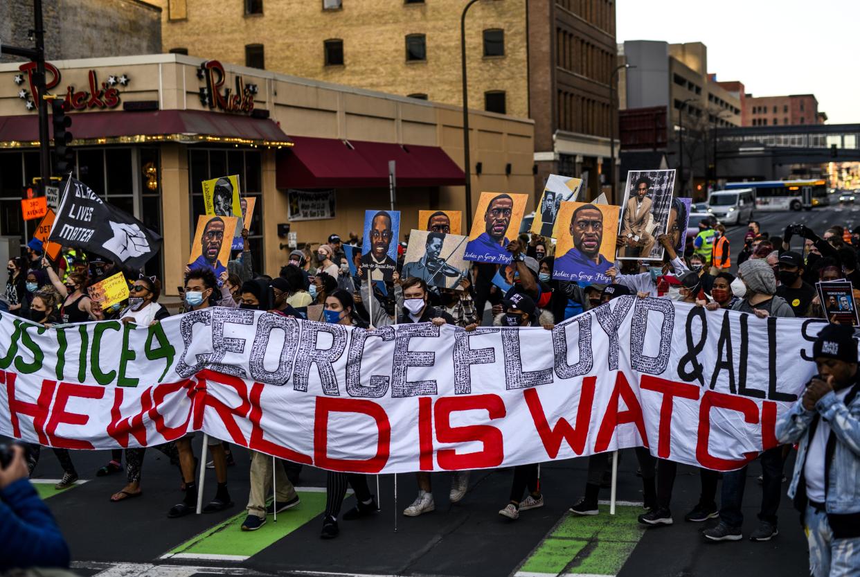 People gather during a demonstration outside the Hennepin County Government Center on March 29, 2021, in Minneapolis, Minnesota.