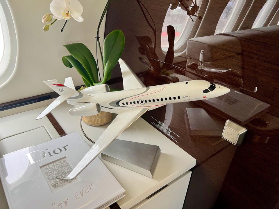 A model of the 6X plane sitting on a table inside the jet at the Paris airshow.