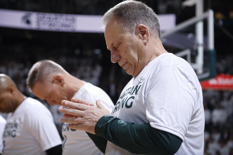 Michigan State coach Tom Izzo observes a moment of silence before the team's NCAA college basketball game against Indiana, Tuesday, Feb. 21, 2023, in East Lansing, Mich. Hundreds of people filled a Detroit church Tuesday for the funeral of a 19-year-old Detroit-area woman, an aspiring doctor who was one of three students fatally shot last week at Michigan State. (AP Photo/Al Goldis)