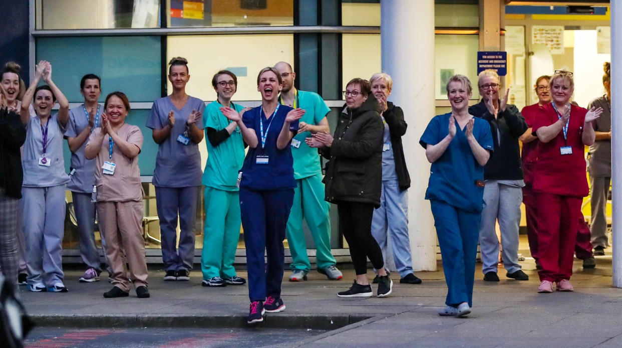 Staff from the Royal Liverpool University Hospital join in a national applause during Thursday's nationwide Clap for Carers NHS initiative to applaud NHS workers fighting the coronavirus pandemic.