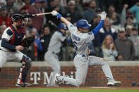 Los Angeles Dodgers' Trea Turner strikes out in the seventh to end the inning against the Atlanta Braves in Game 1 of baseball's National League Championship Series Saturday, Oct. 16, 2021, in Atlanta.(AP Photo/Ashley Landis)