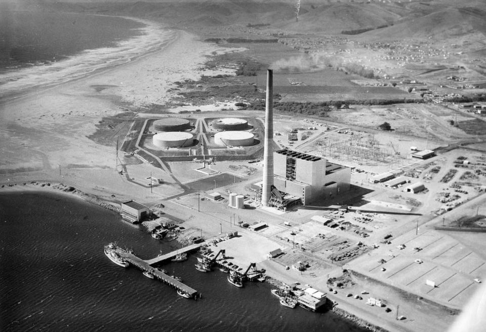 PG&E dedicated its $44 million steam power plant at Morro Bay in July 1955. This aerial view, looking north from Morro Bay harbor, shows the entire station ahead of the dedication