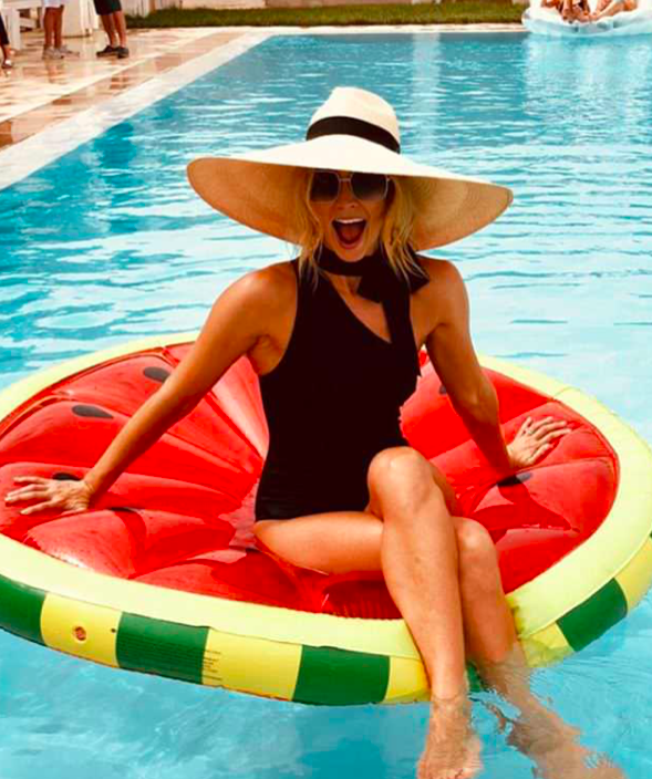 <p>Anna takes a cute snap while on a floating watermelon pool toy. Source: Instagram/annaheinrich1 </p>