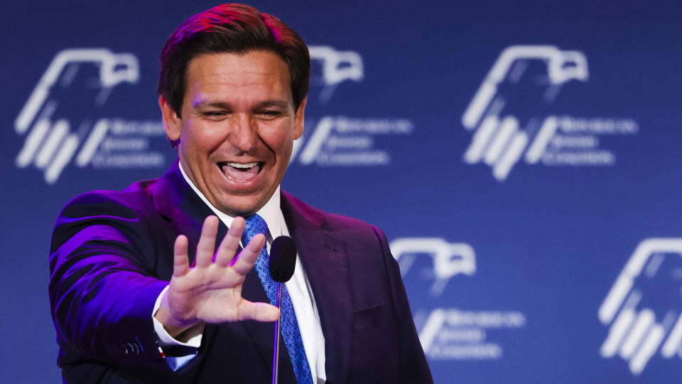 Republican Florida Governor Ron DeSantis waves to supporters.