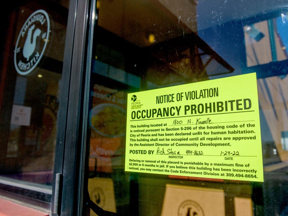 A sign from the city of Peoria declares the Popeyes Louisiana Kitchen restaurant at 1800 N. Knoxville Ave. to be "unfit for human habitation" after a grease spill. The eatery is closed temporarily until the issue can be resolved.