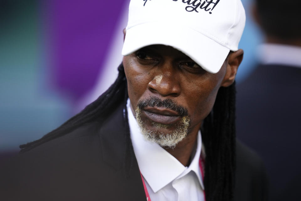 Cameroon's head coach Rigobert Song arrives to the field for the World Cup group G soccer match between Cameroon and Serbia, at the Al Janoub Stadium in Al Wakrah, Qatar, Monday, Nov. 28, 2022. (AP Photo/Manu Fernandez)